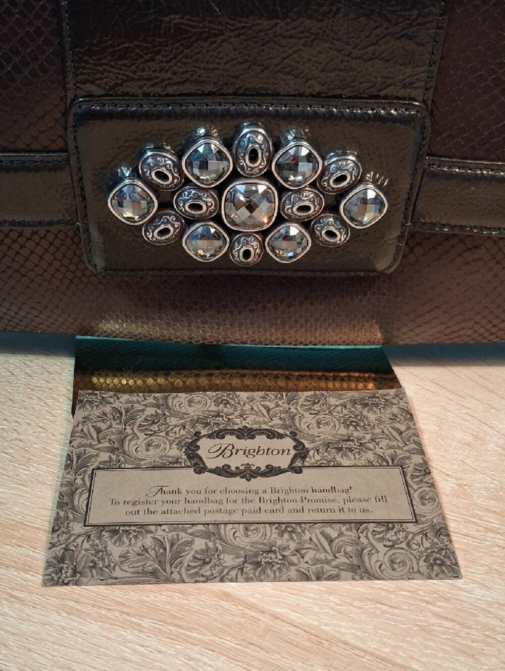 Brighton Bronze Snake Embossed Studded Clutch with Heart Charm - Picture 12 of 14